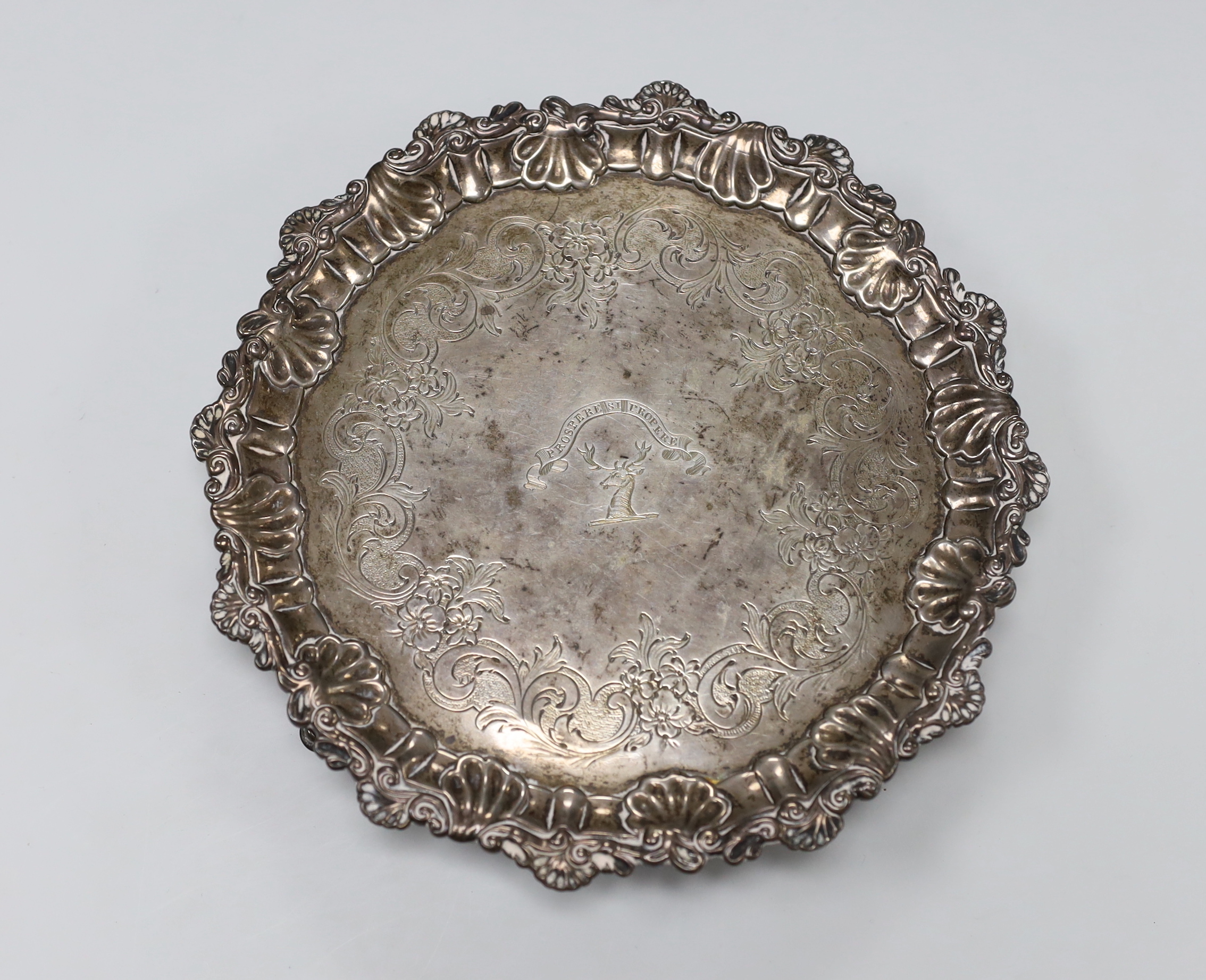 A late George II silver waiter, with engraved crest and later chased decoration, Ebenezer Coker, London, 1758, 19.2cm, 8.4 oz.